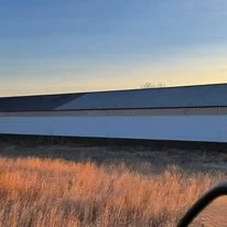 Commercial building with foam insulation installed on exterior walls and roof system