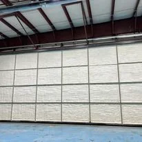 Foam insulation panels installed on residential garage door in grid pattern