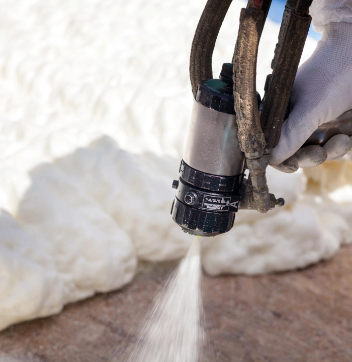 close up of a technician spraying foam insulation casper wy